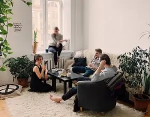 group of people chatting in living room