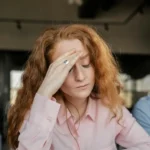 Woman in shirt showing frustation