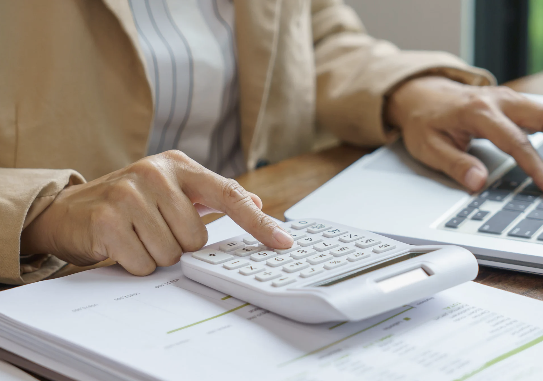 Property Management Fees: What Are You Actually Paying For? A photo of someone typing in fees.